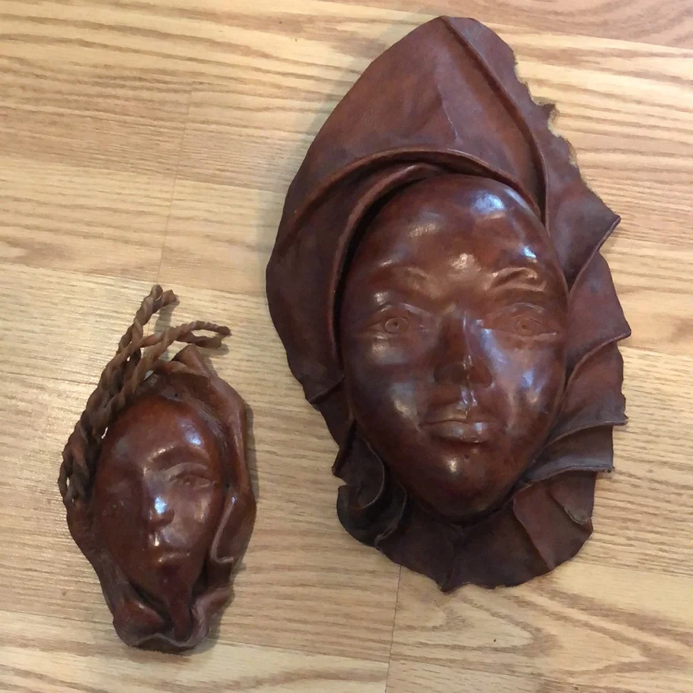VINTAGE HAND MOLDED LEATHER WOMAN AND CHILD FACES